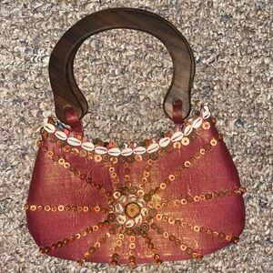 Iridescent bag with shell embroidery